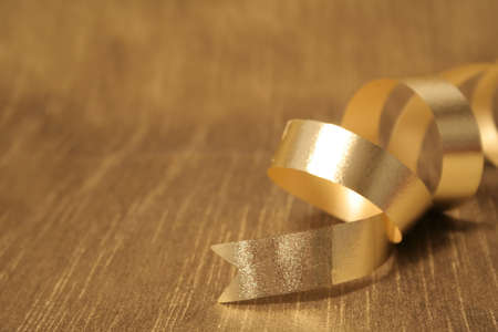 A ribbon sitting on a gold backgroundの写真素材