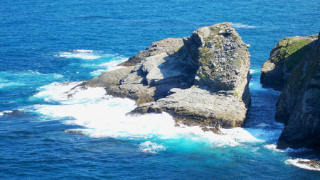 Waves crashing against rocks on the coast of northern spainの写真素材