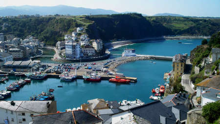 Coastal town of Luarca Spain sits next to the oceanの写真素材