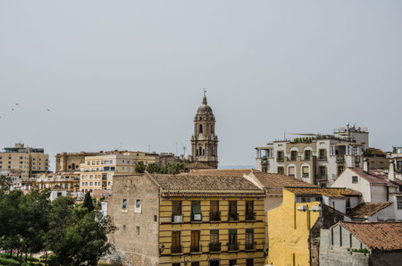 Malaga, Spain - March 17 2017: Old buildings in Malaga, with the Cathedral's tower in the backgroundのeditorial素材
