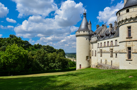 The facade of a castle, with a view towards its garden, on top of a hill, on a sunny dayのeditorial素材