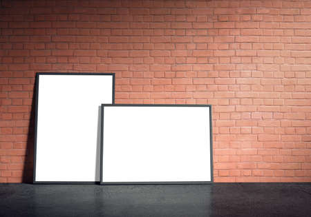 Blank white paper poster in black frame at red brick wall and concrete floor. Grungy interior, poster mock up. Presentation for artwork. 3d rendering illustrationの写真素材