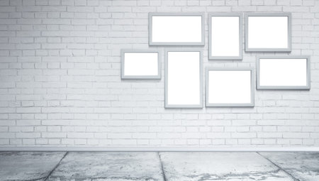 Blank white photo frames at white brick wall and concrete floor. Grungy interior, poster mock up....