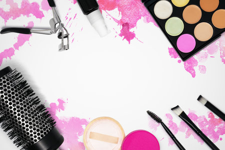 Glamor still life photo of cosmetics on pink watercolor hand drawn backdrop. Woman's make up table. Graphic template mock up.の写真素材