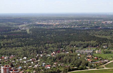 Aerial view of city with buildings and roadsの写真素材