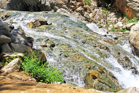 Beautiful waterfall in mountainsの写真素材