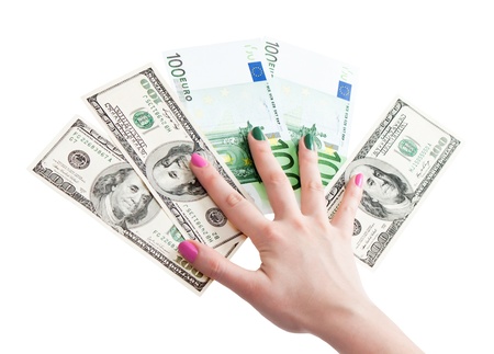 Woman's hand holding 100 US dollar banknotes, isolated on white background の写真素材
