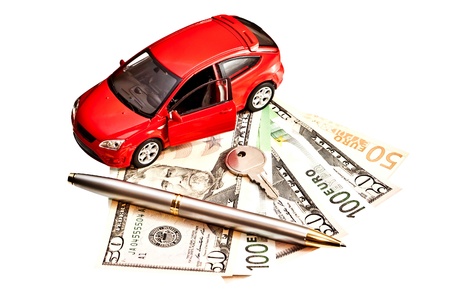 Toy car, key, pen and money over white  Rent, buy or insurance car conceptの写真素材