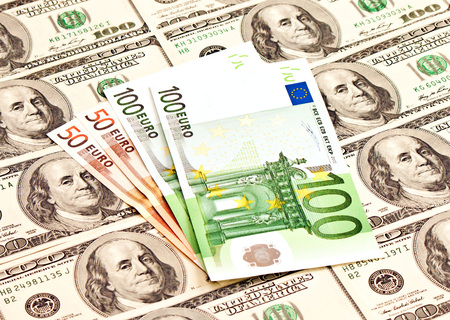 A heap of dollars and euro banknotesの写真素材