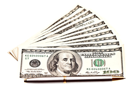 Business picture: money and pen over whiteの写真素材