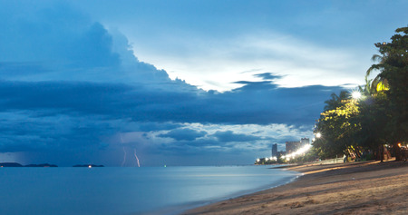 Sunset and lightning on Jomtien beach, Pattaya, Thailandの写真素材