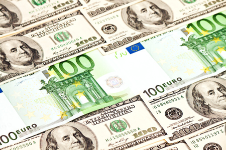 A heap of dollars and euro banknotesの写真素材