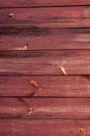 the background of the red older boards processed rudelyの写真素材