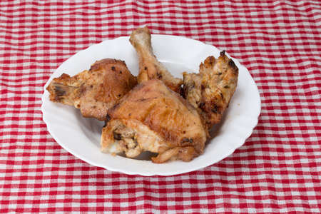 a plate of fried chicken on a red tableclothの写真素材