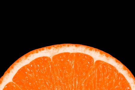 Slice of juicy tropical fruit grapefruit on a black backgroundの写真素材