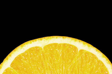 Slice of juicy tropical fruit lemon on a black backgroundの写真素材