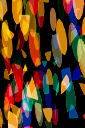 bokeh in the form of colored shapes on a black background