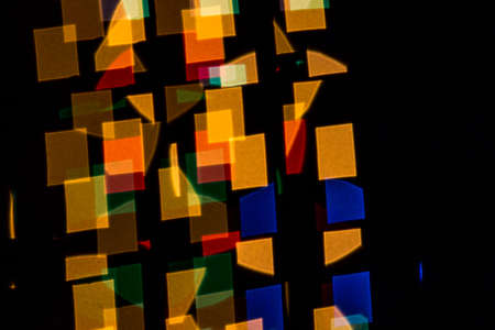 Black background with colored shapes stand uprightの写真素材