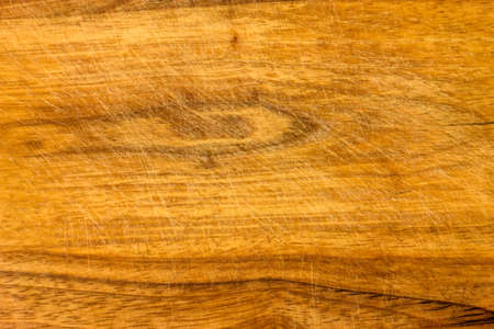 indented surface of the cutting board with a knife as a backgroundの写真素材