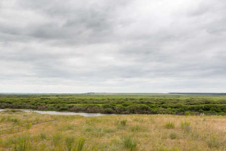view from the high hill on the steppes of the riverの写真素材