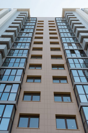 multistorey highrise apartment building on the sky background