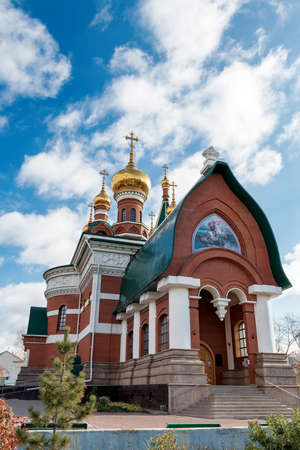 Orthodox church from a red brick against the blue skyの写真素材