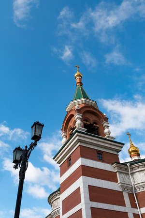 Orthodox Christian church with gold domes rises upwardsの写真素材