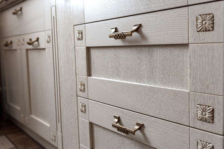 Retro handles metal cabinet in the kitchenの写真素材