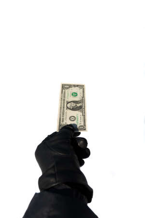 man holds a black glove one dollar isolated on white backgroundの写真素材
