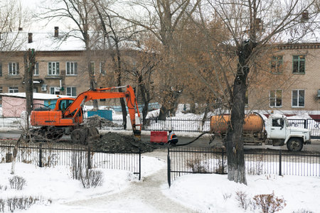 Workers repair the water pipe in the street