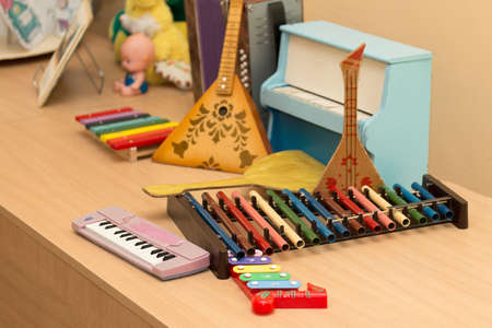 Antique antique toys musical instruments balalaika, accordion, harpsichord, pianoの写真素材