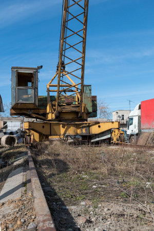 a construction crane against a blue sky background