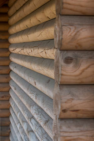 The wall of a wooden house from calibrated logsの写真素材