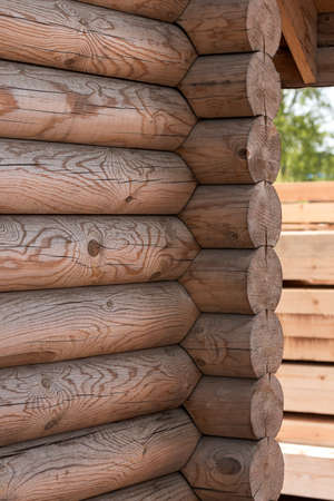 Wooden house from calibrated logs of brown colorの写真素材