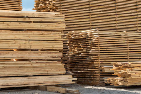 Lumber, boards and timber lie in a pileの写真素材
