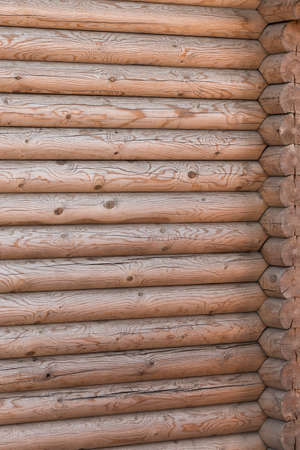 Wooden house from calibrated logs of brown colorの写真素材