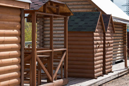Wooden house from calibrated logs of brown colorの写真素材