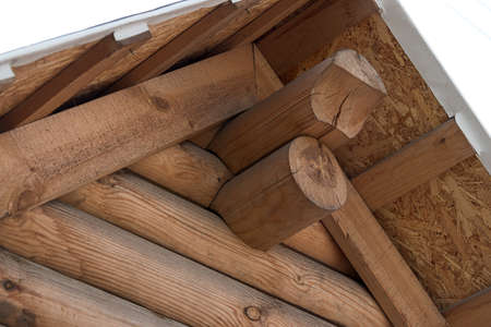 Wooden house from calibrated logs of brown colorの写真素材