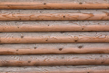 The wall of a wooden house from calibrated logsの写真素材