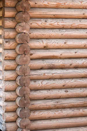 Wooden house from calibrated logs of brown colorの写真素材