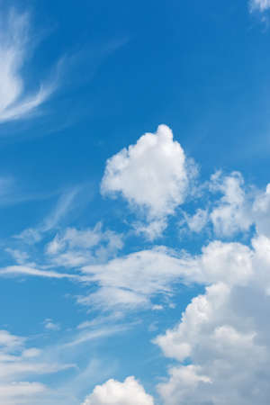 White fluffy big clouds against blue skyの写真素材
