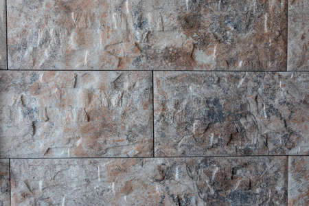 Large stone tile glued to the wallの写真素材
