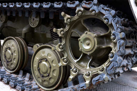 Caterpillar of a military tank black close-upの写真素材