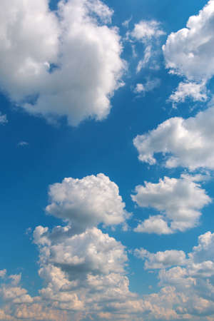 White fluffy cloud against a blue skyの写真素材