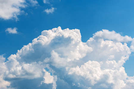 white big cloud against blue skyの写真素材