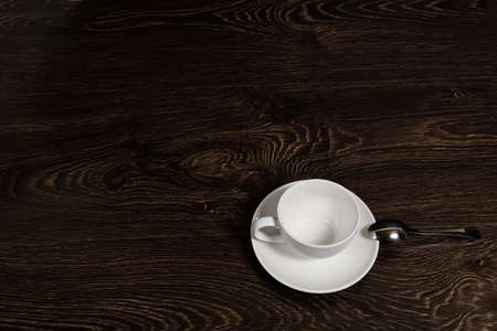 an empty tea-cup on the tableの写真素材
