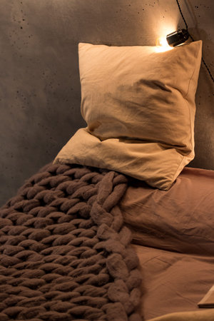 the pillow is lying on the bedの写真素材