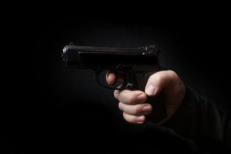 gun in the hand of man