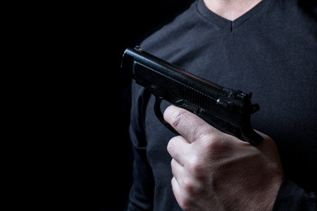 gun in the hand of man