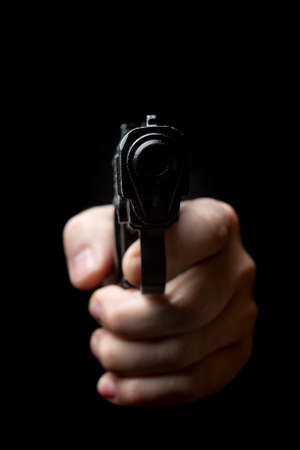 gun in the hand of manの写真素材